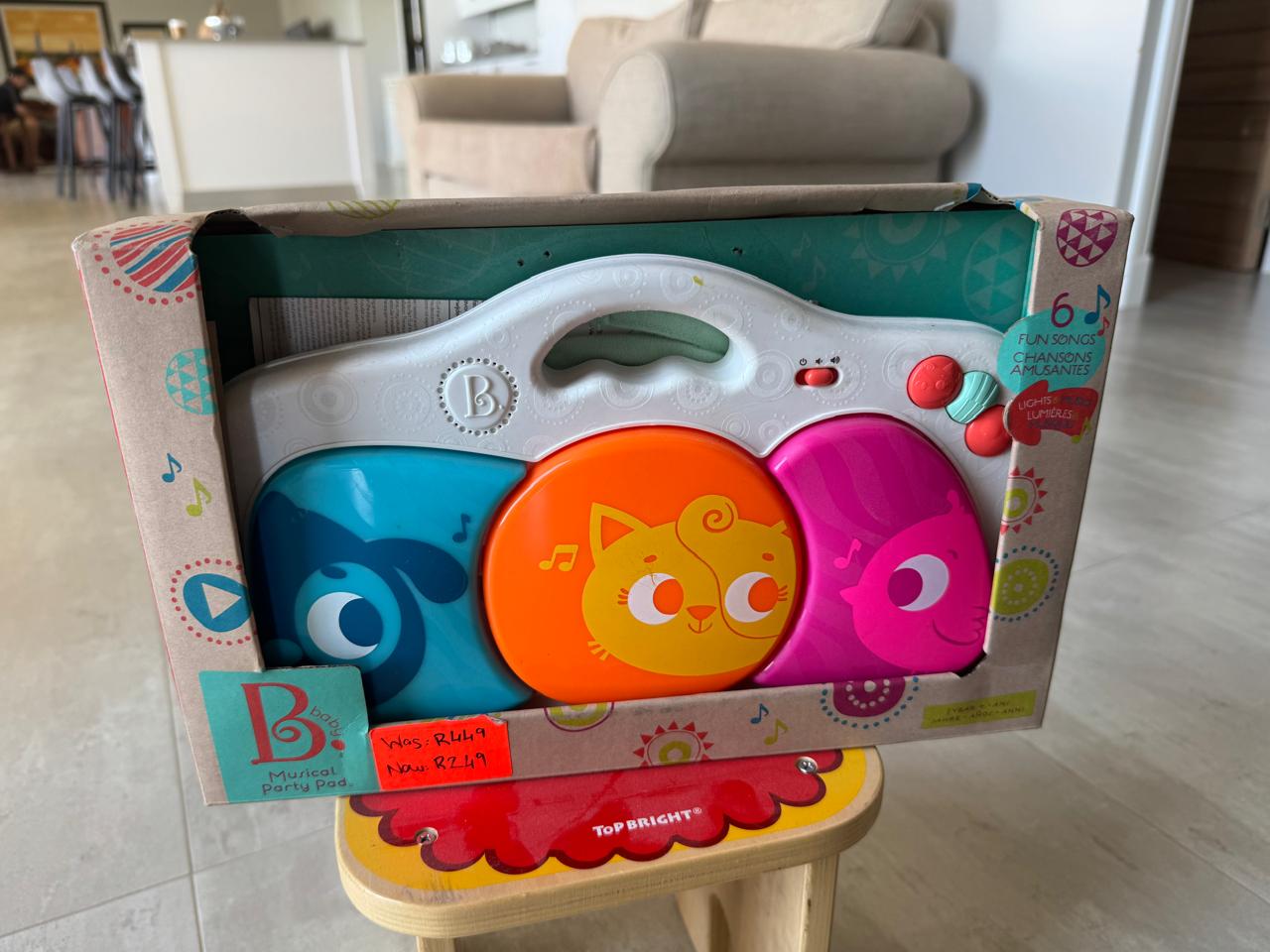 B. Toys  Kick and Play Musical Party Pad - BOX DAMAGED